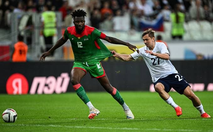 Russia Soccer Friendly Russia - Burkina Faso 9183457 05.06.2026 Burkina Faso s Edmond Tapsoba and Russia s Ivan Oblyakov struggle for a ball during the friendly soccer match between Russia and Burkina Faso at Volgograd Arena stadium, in Volgograd, Russia. Maksim Blinov Sputnik Volgograd Russia  Copyright: xMaksimxBlinovx