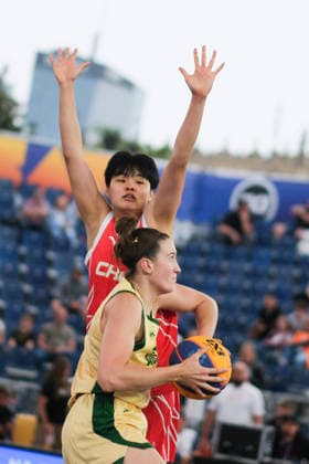 June 5, 2026, Warsaw, Masovian Voivodeship, Poland: Australia s HANNAH HANK (12) and China s WENXIA LI (21) in action during a FIBA 3x3 Basketball World Cup women s last 16 game between Australia and China in Warsaw, Poland. Warsaw Poland - ZUMAk204 20260605_zip_k204_007 Copyright: xRomanxKozielx