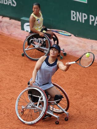 (260606) -- PARIS, June 6, 2026 -- Zhu Zhenzhen (front) Kamiji Yui compete during the wheelchair tennis women s doubles final match between Zhu Zhenzhen (China) Kamiji Yui (Japan) and Jinte Bos Lizzy de Greef of the Netherlands at the French Open tennis tournament at Roland Garros, Paris, France, June 5, 2026. ) ?(SP)FRANCE-PARIS-WHEELCHAIR TENNIS-FRENCH OPEN-WOMEN S DOUBLES-FINAL? WuxHuiwo 