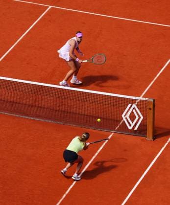 Mirra Andreeva and Maja Chwalinska in singles final action at the net French Open Tennis, Day Fourteen, Tennis, Roland Garros, Paris, France - 06 Jun 2026Paris Roland Garros France EDITORIAL USE ONLY No use with unauthorised audio, video, data, fixture lists, club league logos or live services. Online in-match use limited to 120 images, no video emulation. No use in betting, games or single club league player publications. Copyright: xJavierxGarcia Shutterstockx 16906570o