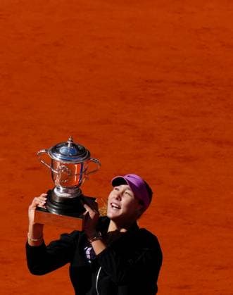 Mirra Andreeva celebrates with the trophy French Open Tennis, Day Fourteen, Tennis, Roland Garros, Paris, France - 06 Jun 2026Paris Roland Garros France EDITORIAL USE ONLY No use with unauthorised audio, video, data, fixture lists, club league logos or live services. Online in-match use limited to 120 images, no video emulation. No use in betting, games or single club league player publications. Copyright: xJavierxGarcia Shutterstockx 16906570ab