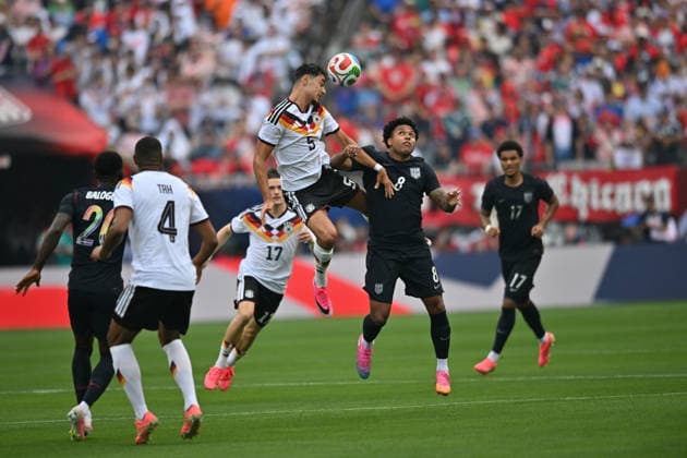 CHICAGO, IL - JUNE 06: Germany defensive midfielder Aleksandar Pavlovic (5) heads the ball against United States central midfielder Weston McKennie (8) during a friendly match between the United States and Germany on June 6, 2026, at Soldier Field in Chicago, IL. (Photo by Patrick Gorski Icon Sportswire) SOCCER: JUN 06 USA vs Germany EDITORIAL USE ONLY Icon260606003