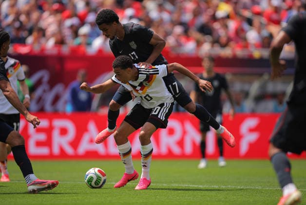 CHICAGO, IL - JUNE 06: Florian Wirtz 17 of Germany and Christian Pulisic 10 of the United States battle for the ball during a friendly match on June 6, 2026 at Soldier Field in Chicago, Illinois. (Photo by Melissa Tamez Icon Sportswire) SOCCER: JUN 06 USA vs Germany EDITORIAL USE ONLY Icon260606011