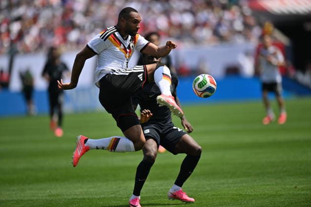 CHICAGO, IL - JUNE 06: Germany center back Jonathan Tah (4) controls the ball against United States striker Folarin Balogun (20) during a friendly match between the United States and Germany on June 6, 2026, at Soldier Field in Chicago, IL. (Photo by Patrick Gorski Icon Sportswire) SOCCER: JUN 06 USA vs Germany EDITORIAL USE ONLY Icon260606010