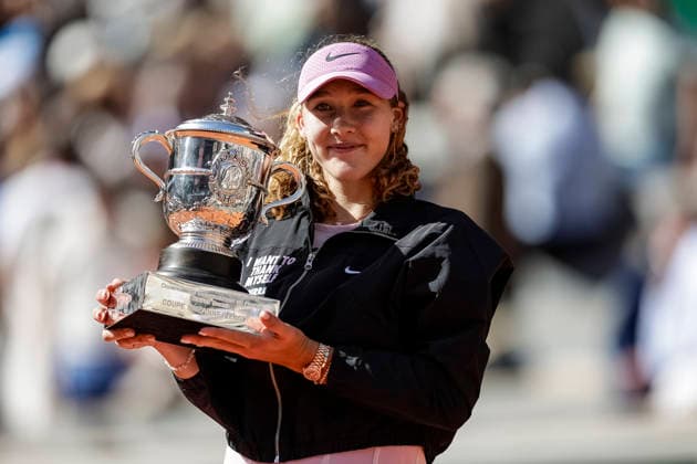 Paris, France - June 6: Mirra Andreeva celebrates with the winner™s trophy after winning her match against Maja Chwalinska of Poland during the Women™s Final on Day Fourteen of the 2026 French Open at Roland Garros on June 6, 2026 in Paris, France. (Photo by JustPictures) Paris Roland Garros France