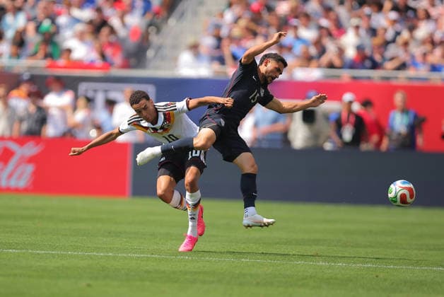 CHICAGO, IL - JUNE 06: Jamal Musiala 10 of Germany and Cristian Roldan 15 of the United States in action during a friendly match on June 6, 2026 at Soldier Field in Chicago, Illinois. (Photo by Melissa Tamez Icon Sportswire) SOCCER: JUN 06 USA vs Germany EDITORIAL USE ONLY Icon260606015