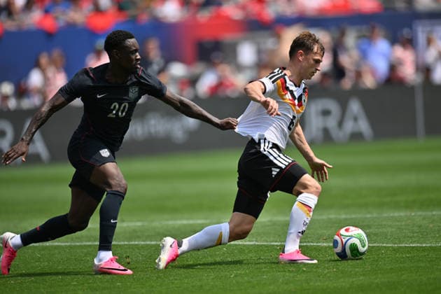 CHICAGO, IL - JUNE 06: United States striker Folarin Balogun (20) and Germany right back Joshua Kimmich (6) battle for the ball during a friendly match between the United States and Germany on June 6, 2026, at Soldier Field in Chicago, IL. (Photo by Patrick Gorski Icon Sportswire) SOCCER: JUN 06 USA vs Germany EDITORIAL USE ONLY Icon260606022