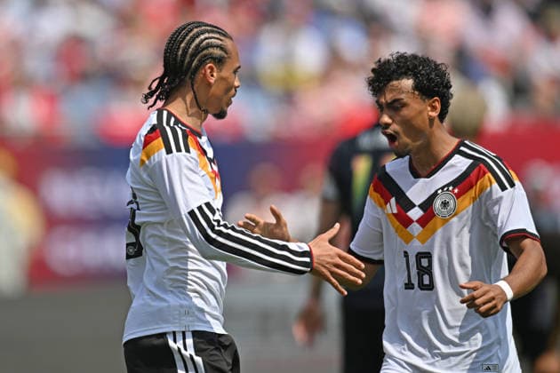 CHICAGO, IL - JUNE 06: Germany right wing Leroy SanÃ (19) celebrates with defender Nathaniel Brown (18) after scoring a goal during a friendly match between the United States and Germany on June 6, 2026, at Soldier Field in Chicago, IL. (Photo by Patrick Gorski Icon Sportswire) SOCCER: JUN 06 USA vs Germany EDITORIAL USE ONLY Icon260606026