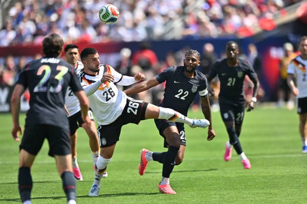 CHICAGO, IL - JUNE 06: Germany forward Deniz Undav (26) and United States defender Mark McKenzie (22) battle for the ball during a friendly match between the United States and Germany on June 6, 2026, at Soldier Field in Chicago, IL. (Photo by Patrick Gorski Icon Sportswire) SOCCER: JUN 06 USA vs Germany EDITORIAL USE ONLY Icon260606035