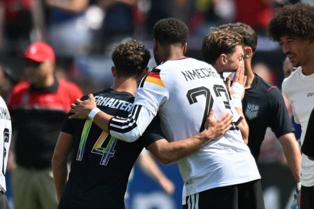 CHICAGO, IL - JUNE 06: United States midfielder Sebastian Berhalter (14) hugs Germany midfielder Felix Nmecha (23) after a friendly match between the United States and Germany on June 6, 2026, at Soldier Field in Chicago, IL. (Photo by Patrick Gorski Icon Sportswire) SOCCER: JUN 06 USA vs Germany EDITORIAL USE ONLY Icon260606044