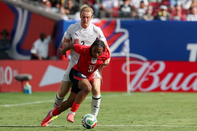 RECORD DATE NOT STATED 6th June 2026; Raymond James Stadium, Tampa, Florida, United States of America; Friendly International Football, England versus New Zealand; Ngumoha Rio of England is grabbed by Francis de Vries of New Zealand DavidxBuono