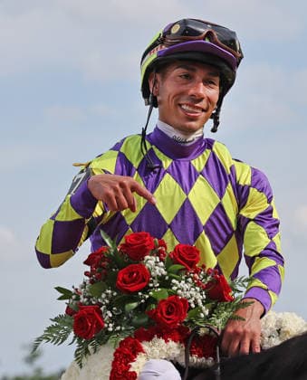 Jose Ortiz, winner of the Woody Stephens Handicap aboard Englishman, heads to the winners circle after the win at Saratoga Race Course in Saratoga Springs, NY, on Belmont day here. June 6, 2026, photo by Mark Abraham UPI  SAR20260606102 MARKxABRAHAM