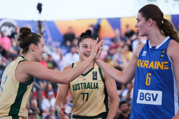 June 6, 2026, Warsaw, Masovian Voivodeship, Poland: Australia s HANNAH HANK (12) high fives Ukraine s KATERYNA KOVAL (6) as Australia s EMMA CLARKE (77) smiles in victory at the end of a FIBA 3x3 Basketball World Cup women s quarter-final game between Australia and Ukraine in Warsaw, Poland. Warsaw Poland - ZUMAk204 20260606_zip_k204_051 Copyright: xRomanxKozielx