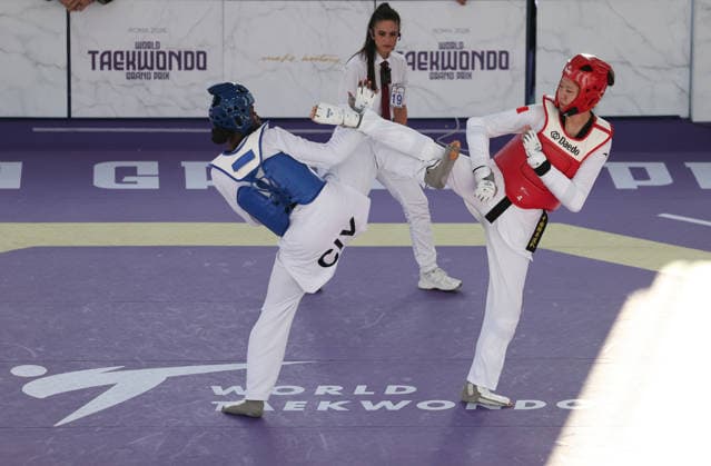 (260607) -- ROME, June 7, 2026 -- Mu Wenzhe (R) of China competes with Kimi Laurene Ossin (L) of Cote d Ivoire during their women s +67kg final match at Roma 2026 World Taekwondo Grand Prix in Rome, Italy, June 6, 2026. ) (SP)ITALY-ROME-TAEKWONDO-ROMA 2026 GRAND PRIX-WOMEN S +67KG LixJing 