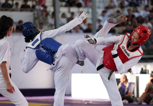 (260607) -- ROME, June 7, 2026 -- Mu Wenzhe (R) of China competes with Kimi Laurene Ossin of Cote d Ivoire during their women s +67kg final match at Roma 2026 World Taekwondo Grand Prix in Rome, Italy, June 6, 2026. ) (SP)ITALY-ROME-TAEKWONDO-ROMA 2026 GRAND PRIX-WOMEN S +67KG LixJing 
