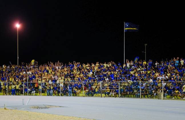 WILLEMSTAD - Football fans in the stands during the friendly international match, Länderspiel, Nationalmannschaft between Curacao and Aruba at the Ergilio Hato Stadium. In the run-up to the World Cup in the United States, Canada, and Mexico, Curacao won its farewell match in Willemstad 4-0 against Aruba. RAMSAY SOEMANTA ANP xVIxANPxSportx xxANPxIVx 560351551 originalFilename: 560351551.jpg