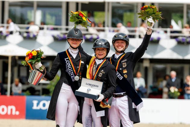BALVE - LONGINES Balve Optimum 2026, BALVE - LONGINES Balve Optimum 2026 WERTH Isabell (GER), ROTHENBERG Semmieke (GER), NETZ Raphael (GER) Meisterehrung Sektdusche Deutsche Meisterschaften Dressur Grand Prix Kür 2026 - Grand Prix Kür Freestyle LONGINES GROSSER OPTIMUM PREIS 2026 präsentiert von der MEGGLE Group GmbH Dressurprüfung Kl.S