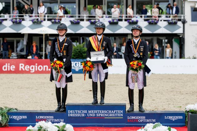 BALVE - LONGINES Balve Optimum 2026, BALVE - LONGINES Balve Optimum 2026 WERTH Isabell (GER), ROTHENBERG Semmieke (GER), NETZ Raphael (GER) Meisterehrung Sektdusche Deutsche Meisterschaften Dressur Grand Prix Kür 2026 - Grand Prix Kür Freestyle LONGINES GROSSER OPTIMUM PREIS 2026 präsentiert von der MEGGLE Group GmbH Dressurprüfung Kl.S