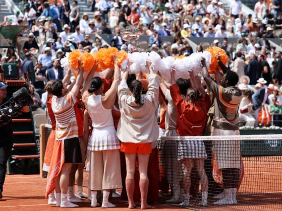 (260607) -- PARIS, June 7, 2026 -- Performers hold the trophy before the men s singles final match between Alexander Zverev of Germany and Flavio Cobolli of Italy at the French Open tennis tournament at Roland Garros, Paris, France, June 7, 2026. ) (SP)FRANCE-PARIS-TENNIS-FRENCH OPEN-MEN S SINGLES-FINAL WuxHuiwo 