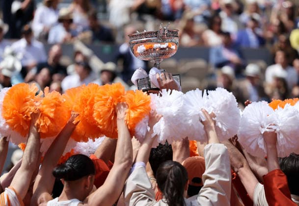 (260607) -- PARIS, June 7, 2026 -- Performers hold the trophy before the men s singles final match between Alexander Zverev of Germany and Flavio Cobolli of Italy at the French Open tennis tournament at Roland Garros, Paris, France, June 7, 2026. ) (SP)FRANCE-PARIS-TENNIS-FRENCH OPEN-MEN S SINGLES-FINAL WuxHuiwo 
