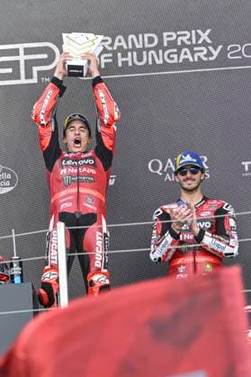 MOTO - MOTO GP - HUNGARY GRAND PRIX 2026 MARQUEZ Marc (spa), Ducati Lenovo Team, Ducati Desmosedici GP26, portrait celebrates his victory on podium with BAGNAIA Francesco (ita), Ducati Lenovo Team, Ducati Desmosedici GP26, portrait during the 2026 MotoGP Grand Prix of Hungary , on Balaton Park circuit, from June 5 to 7, in Hungary - Balaton ParkHungary  Copyright: xGIGIxSOLDANOx