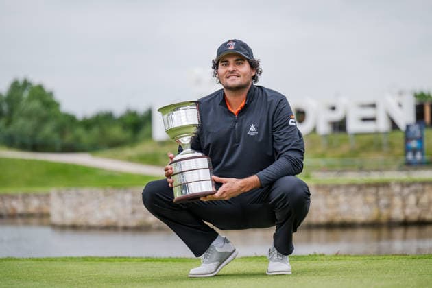 AMSTERDAM, NETHERLANDS - JUNE 07: Eugenio Chacarra of Spain with the tournament winners trophy on the 18th green after winning during the final round of the KLM Open at The International on June 7, 2026 in Amsterdam, Netherlands. Credit: Andy Astfalck NurPhoto Netherlands Copyright: xAndyxAstfalckx