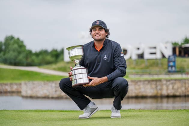 AMSTERDAM, NETHERLANDS - JUNE 07: Eugenio Chacarra of Spain with the tournament winners trophy on the 18th green after winning during the final round of the KLM Open at The International on June 7, 2026 in Amsterdam, Netherlands. Credit: Andy Astfalck NurPhoto Netherlands Copyright: xAndyxAstfalckx