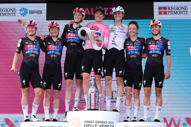 The team with The pink jersey Netherlands™s Demi Vollering of FDJ United - Suez™s celebrate on the podium after the stage 9 of the Giro d™Italia Women, from Saluzzo to Saluzzo, Italy, Sunday, June 7, 2026.  Copyright: xDavidexSpada Lapressex