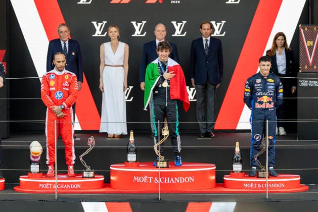 MONTE-CARLO, MONACO - JUNE 07: Kimi Antonelli (12) of Italy and Mercedes-AMG PETRONAS Formula One Team, Lewis Hamilton (44) of Great Britain and Scuderia Ferrari HP and Isack Hadjar (6) of France and Oracle Red Bull Racing listen to the national anthems after the F1 Monaco Grand Prix on June 7, 2026 at the Circuit de Monaco in Monte-Carlo, Monaco. (Photo by Bob Kupbens Icon Sportswire) AUTO: JUN 07 F1 Monaco Grand Prix EDITORIAL USE ONLY Icon2606070401
