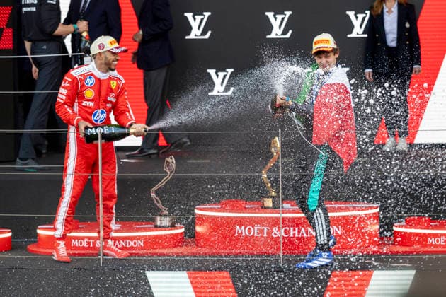 MONTE-CARLO, MONACO - JUNE 07: Lewis Hamilton (44) of Great Britain and Scuderia Ferrari HP sprays champagne at Kimi Antonelli (12) of Italy and Mercedes-AMG PETRONAS Formula One Team after the F1 Monaco Grand Prix on June 7, 2026 at the Circuit de Monaco in Monte-Carlo, Monaco. (Photo by Bob Kupbens Icon Sportswire) AUTO: JUN 07 F1 Monaco Grand Prix EDITORIAL USE ONLY Icon2606070451