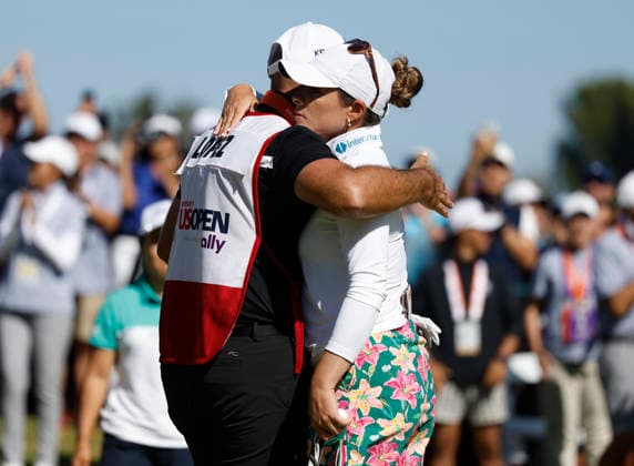 Gaby Lopez of Mexico is congratulated by her caddie after sinking a birdie putt on the 18th hole for a share of the lead during the final round of the 81st Women s U.S. Open golf championship at the Riviera Country Club in Pacific Palisades, California, on Sunday, June 7, 2026.  GLP20260607814 CAROLINExBREHMAN