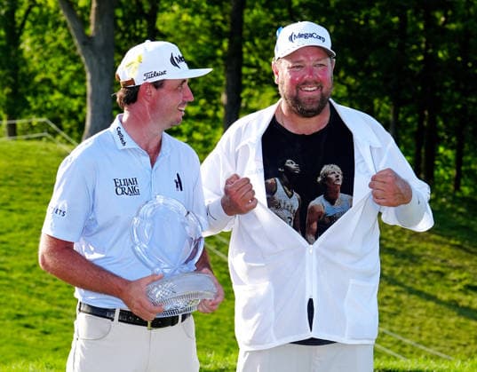 DUBLIN, OH - JUNE 07: PGA, Golf Herren golfer J.T. Poston poses with the trophy and his caddie Aaron Flener on June 7, 2026 after winning the Memorial Tournament presented by Workday at Muirfield Village Golf Club in Dublin, Ohio. (Photo by Brian Spurlock Icon Sportswire) GOLF: JUN 07 PGA the Memorial Tournament presented by Workday EDITORIAL USE ONLY Icon26060738