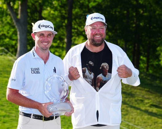 DUBLIN, OH - JUNE 07: PGA, Golf Herren golfer J.T. Poston poses with the trophy and his caddie Aaron Flener on June 7, 2026 after winning the Memorial Tournament presented by Workday at Muirfield Village Golf Club in Dublin, Ohio. (Photo by Brian Spurlock Icon Sportswire) GOLF: JUN 07 PGA the Memorial Tournament presented by Workday EDITORIAL USE ONLY Icon26060739