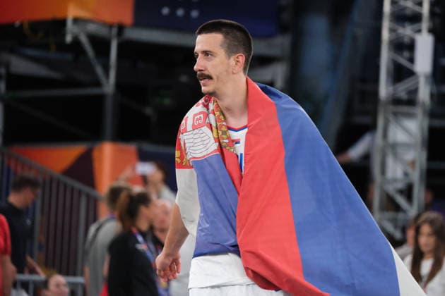 June 7, 2026, Warsaw, Masovian Voivodeship, Poland: Serbia s STRAHINJA STOJACIC (3) wears a Serbian flag in victory at the end of the FIBA 3x3 Basketball World Cup men s 3rd place game between Serbia and France in Warsaw, Poland. Serbia defeated France to win 3rd place in the tournament. Basketball 2026: FIBA 3x3 World Cup Men s 3rd Place: Serbia 20:19 France  - ZUMAk204 20260607_zip_k204_126 Copyright: xRomanxKozielx