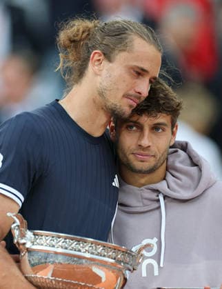 (260608) -- PARIS, June 8, 2026 -- Alexander Zverev (L) and Flavio Cobolli react during the awarding ceremony after the men s singles final match between Alexander Zverev of Germany and Flavio Cobolli of Italy at the French Open tennis tournament at Roland Garros, Paris, France, June 7, 2026. ) (SP)FRANCE-PARIS-TENNIS-FRENCH OPEN-MEN S SINGLES-FINAL WuxHuiwo 