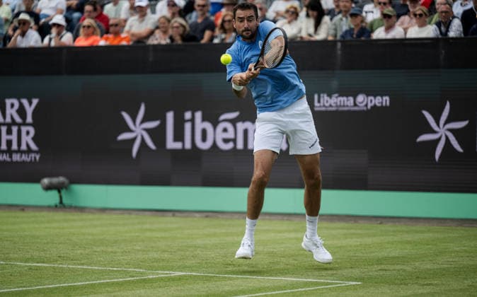 S-HERTOGENBOSCH, NETHERLANDS - JUNE 08: Marin Cilic of Croatia returns a backhand shot against Denis Shapovalov of Canada during their ATP, Tennis Herren Singles First Round match at the LibÃ ma Open on June 8, 2026 at Autotron s-Hertogenbosch in s-Hertogenbosch, Netherlands. Credit: Andy Astfalck NurPhoto Netherlands Copyright: xAndyxAstfalckx