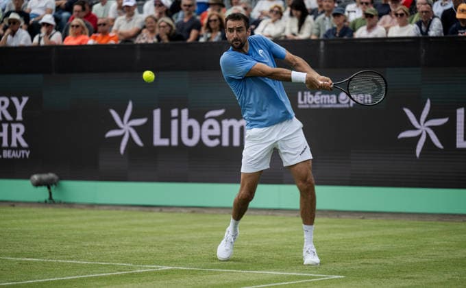 S-HERTOGENBOSCH, NETHERLANDS - JUNE 08: Marin Cilic of Croatia returns a backhand shot against Denis Shapovalov of Canada during their ATP, Tennis Herren Singles First Round match at the LibÃ ma Open on June 8, 2026 at Autotron s-Hertogenbosch in s-Hertogenbosch, Netherlands. Credit: Andy Astfalck NurPhoto Netherlands Copyright: xAndyxAstfalckx