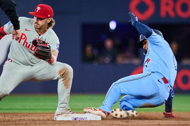 June 8, 2026, Toronto, On, Canada: Philadelphia Phillies second baseman Bryson Stott (5) looks for the throw as Toronto Blue Jays Andres Gimenez (0) slides in safe to second on a double during ninth inning MLB, Baseball Herren, USA baseball action in Toronto, on Monday, June 8, 2026. Canada News - June 8, 2026  - ZUMAc35_ 20260608_zaf_c35_259 Copyright: xSammyxKoganx