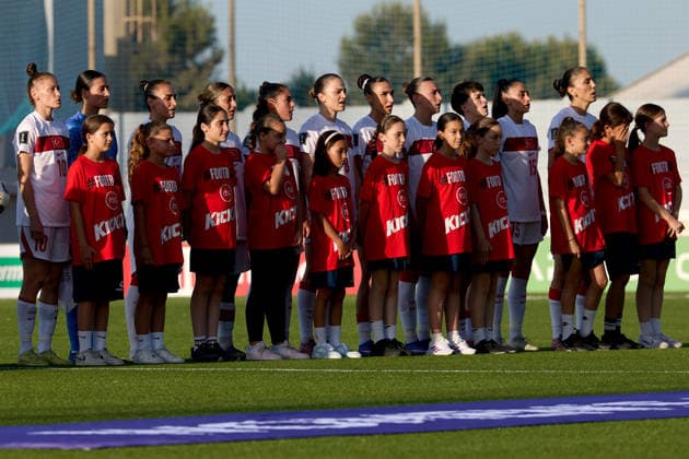 Turkiye women players stand with players escorts during the playing of their country™s national anthem ahead of the UEFA Women™s European Qualifiers League B, Group B2 soccer match between Malta and Turkiye at the Centenary Stadium in Ta™ Qali, Malta, on 09 June 2026. UEFA Women™s European Qualifiers - Malta v Turkiye