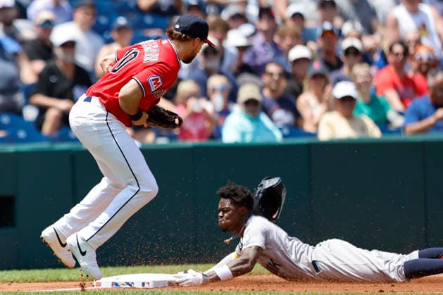 New York Yankees Jazz Chisholm Jr.(13) slides into third base safely in front of Cleveland Guardians Daniel Schneemann (10) for a 2 RBI triple in the second inning at Progressive Field in Cleveland, Ohio on Wednesday, June 10, 2026.  CLE20260610114 AARONxJOSEFCZYK