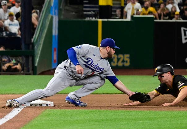 Baseball, MLB, Pittsburgh Pirates - Los Angeles Dodgers Pittsburgh Pirates left fielder Jake Mangum (28) is out attempting to steal third base inning as Los Angeles Dodgers third baseman Max Muncy (13) makes the tag during the seventh inning of the Pittsburgh Pirates 9-8 win over the Los Angeles Dodgers at PNC Park on Wednesday, June 10, 2026 in Pittsburgh.  PIT2026061031 ArchiexCarpenter