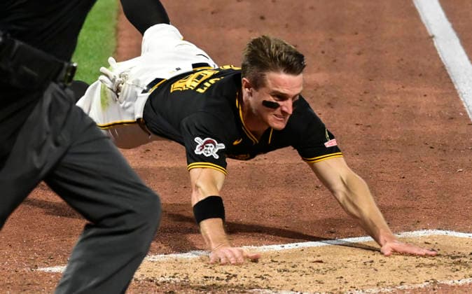 Baseball, MLB, Pittsburgh Pirates - Los Angeles Dodgers Pittsburgh Pirates left fielder Jake Mangum (28) is safe as he slides head first ahead of the throw during the seventh inning of the Pittsburgh Pirates 9-8 win over the Los Angeles Dodgers at PNC Park on Wednesday, June 10, 2026 in Pittsburgh.  PIT2026061037 ArchiexCarpenter