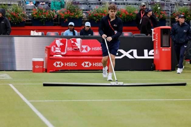 RECORD DATE NOT STATED 11th June 2026; HSBC Championships, Queens Club, West Kensington, London, England; HSBC Championships Tennis, Day Two; A ground man removes the rain of the centre court HongboxChen