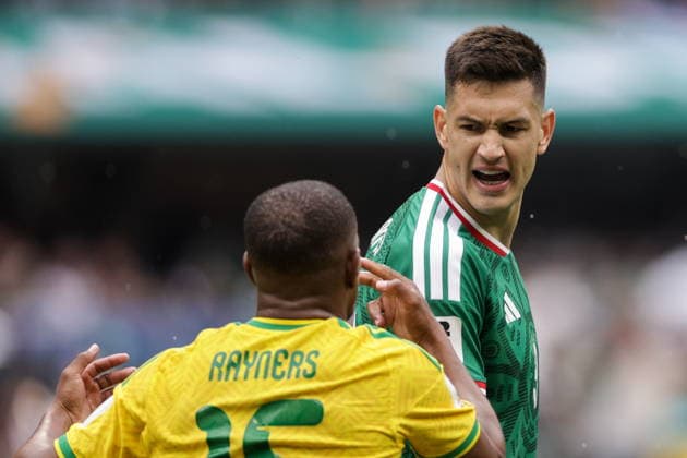 MEXICO, MEXICO CITY - JUNE 11, 2026: South Africa s Iqraam Rayners (L) and Mexico s Cesar Montes fight for the ball in the 2026 FIFA World Cup, WM, Weltmeisterschaft, Fussball Group A football match between Mexico and South Africa at Mexico City Stadium. Mikhail Sinitsyn TASS  93686066