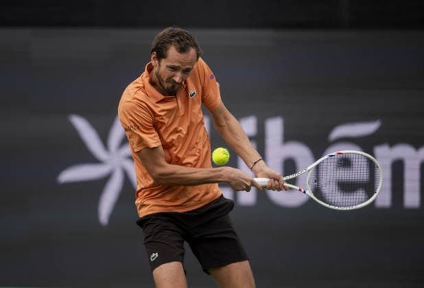 S-HERTOGENBOSCH, NETHERLANDS - JUNE 12: Daniil Medvedev plays a backhand against Thijs Boogaard of the Netherlands during their ATP, Tennis Herren Singles match at the LibÃ ma Open on June 12, 2026 at Autotron s-Hertogenbosch in s-Hertogenbosch, Netherlands. Credit: Andy Astfalck NurPhoto Netherlands Copyright: xAndyxAstfalckx