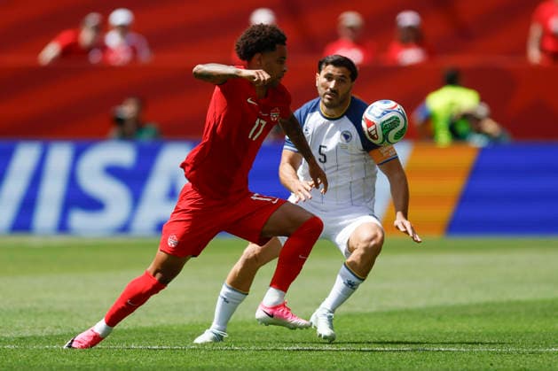 Tajon Buchanan (L) of Canada vies for the ball with Sead Kolasinac of Bosnia and Herzegovina in a Group B match of the 2026 FIFA World Cup, WM, Weltmeisterschaft, Fussball between Canada and Bosnia and Herzegovina at BMO Field in Toronto,Canada, 12 June 2026. Fifa World Cup 2026 - Group B - Canada vs Bosnia and Herzegovina !ACHTUNG: NUR REDAKTIONELLE NUTZUNG!  Copyright: xBienvenidoxVelascox GR5162 0859019288st