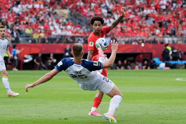 Jovo Lukic of Bosnia and Herzegovina (L) and Tajon Buchanan of Canada (R) challenge for possession of the ball during a group stage match of the 2026 FIFA Men s World Cup between Canada and Bosnia and Herzegovina at Toronto Stadium in Toronto on June 12, 2026. Richard Callis Fotoarena (Richard Callis SPP)  Copyright: xRichardxCallisx xSPPx spp-en-RiCa-2960769