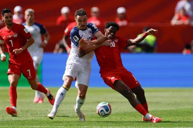 Jonathan David (R) of Canada vies for the ball with Ivan Basic of Bosnia and Herzegovina in a Group B match of the 2026 FIFA World Cup, WM, Weltmeisterschaft, Fussball between Canada and Bosnia and Herzegovina at BMO Field in Toronto,Canada, 12 June 2026. Fifa World Cup 2026 - Group B - Canada vs Bosnia and Herzegovina !ACHTUNG: NUR REDAKTIONELLE NUTZUNG!  Copyright: xBienvenidoxVelascox GR5203 20260612-55020580771_1