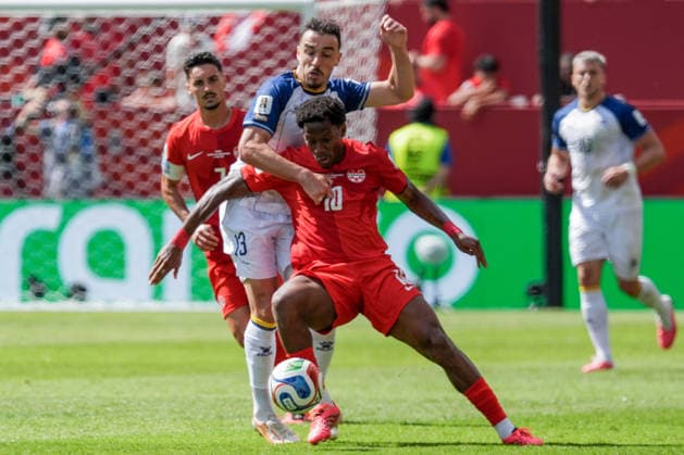 Ivan Basic of Bosnia and Herzegovina (L) and Jonathan David of Canada (R) challenge for possession of the ball during a group stage match of the 2026 FIFA Men s World Cup between Canada and Bosnia and Herzegovina at Toronto Stadium in Toronto on June 12, 2026. Richard Callis Fotoarena (Richard Callis SPP)  Copyright: xRichardxCallisx xSPPx spp-en-RiCa-2960807