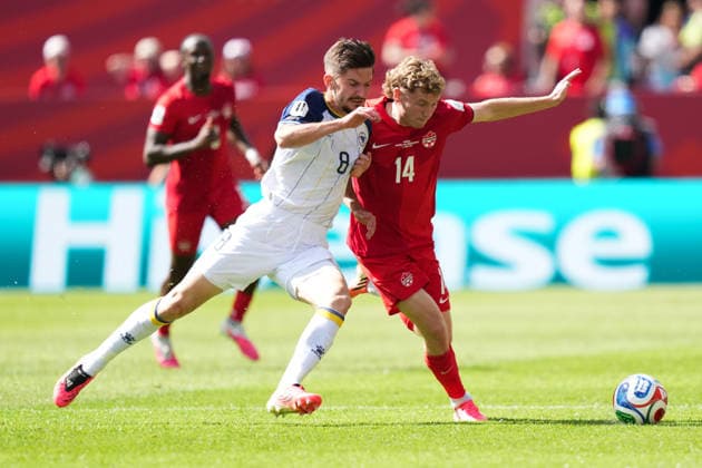 Canada v Bosnia and Herzegovina - 2026 FIFA World Cup, WM, Weltmeisterschaft, Fussball Jacob SHAFFELBURG 14 of Canada and Armin GIGOVIC 08 of Bosnia and Herzegovina battle for the ball during the 2026 FIFA World Cup Group B match between Canada and Bosnia and Herzegovina at Toronto Stadium. on June 12, 2026 in Toronto, Canada. (Photo by Leonardo Ramirez Eyepix Group) Copyright: xLeonardoxRamirezx xEyepixxGroupx LR12062026-05805